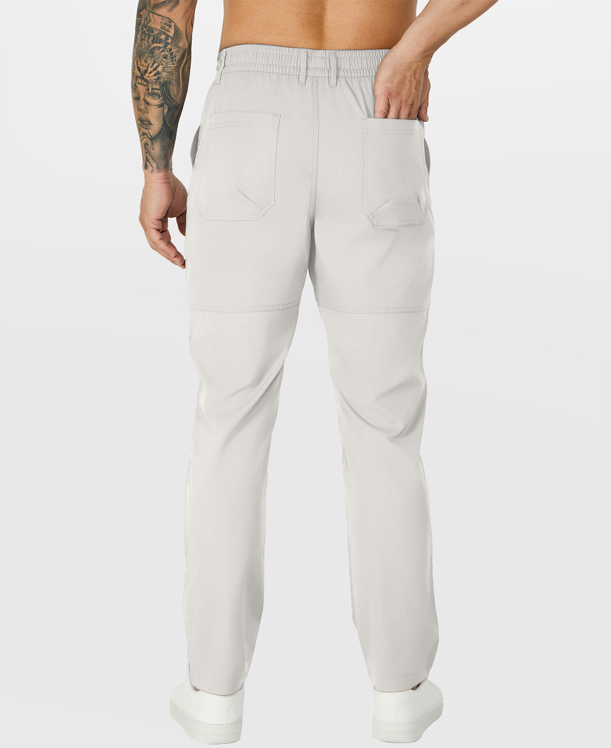 Close-up of back pocket and elastic waistband, emphasizing storage functionality and comfort in multipants.
