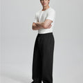 Side view of Men's Fleece Sweatpants ¨C wide-leg silhouette and cozy drape for ultimate comfort.