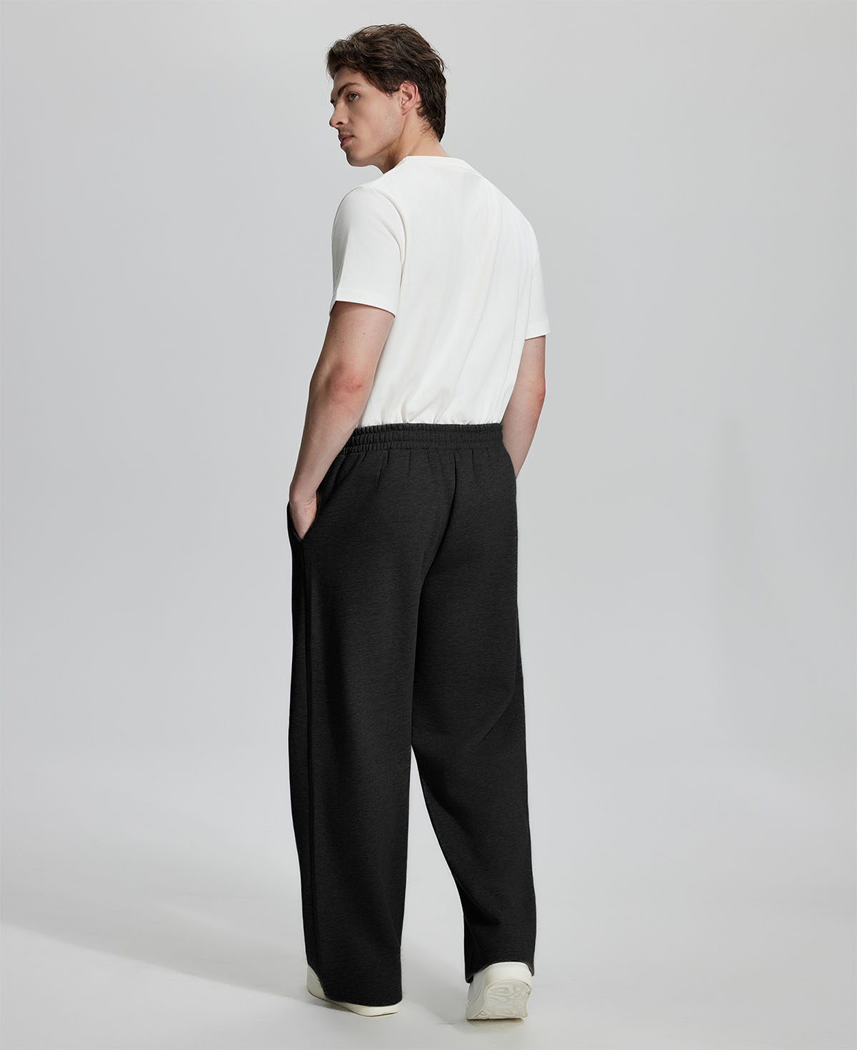 Back view of Men's Fleece Sweatpants ¨C relaxed drape and functional pockets enhance lounge-ready style.