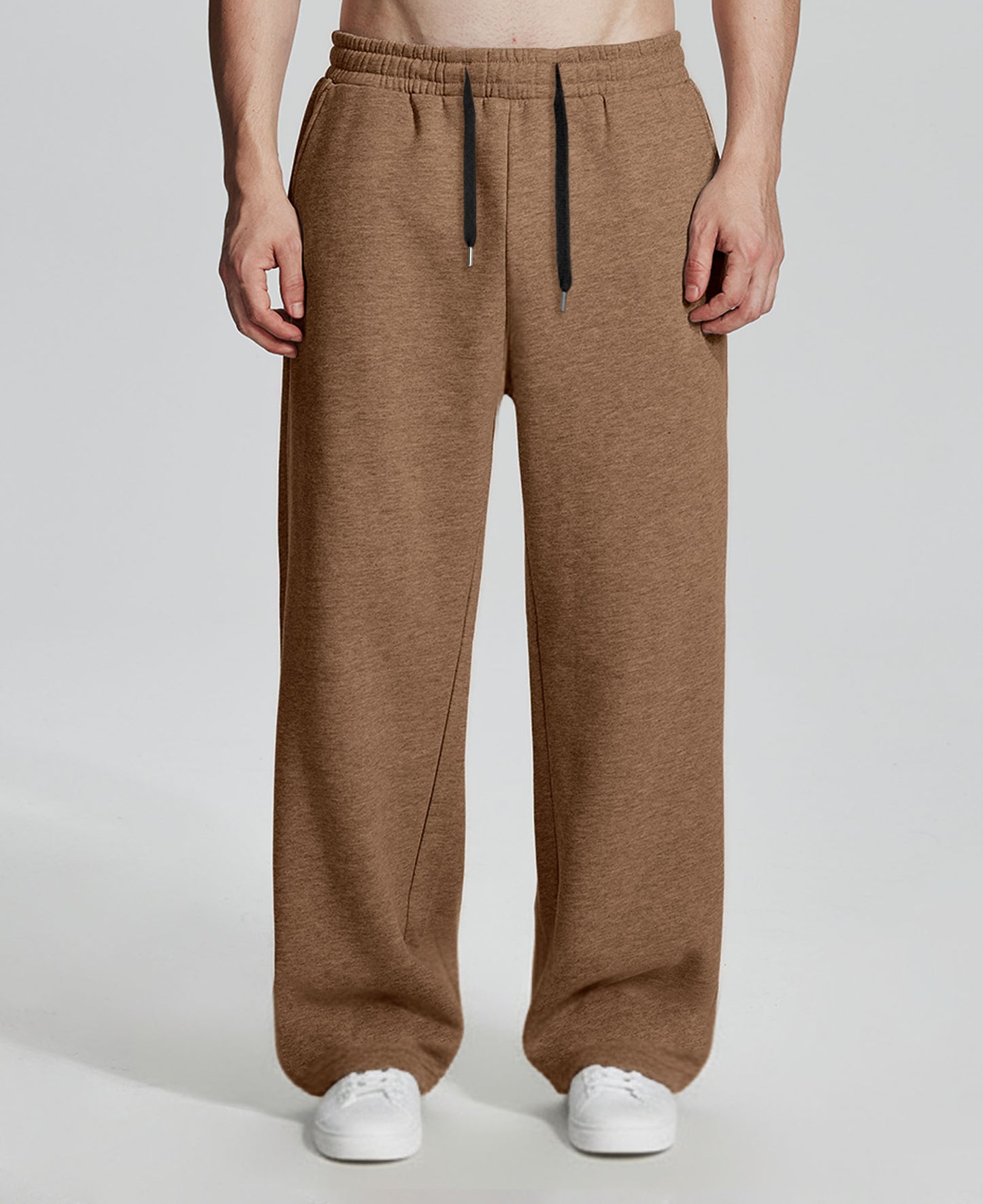 Model in coffee Men's Fleece Sweatpants ¨C Wide Leg Heavyweight Lounge Pants with white sneakers, showing drape and relaxed fit.