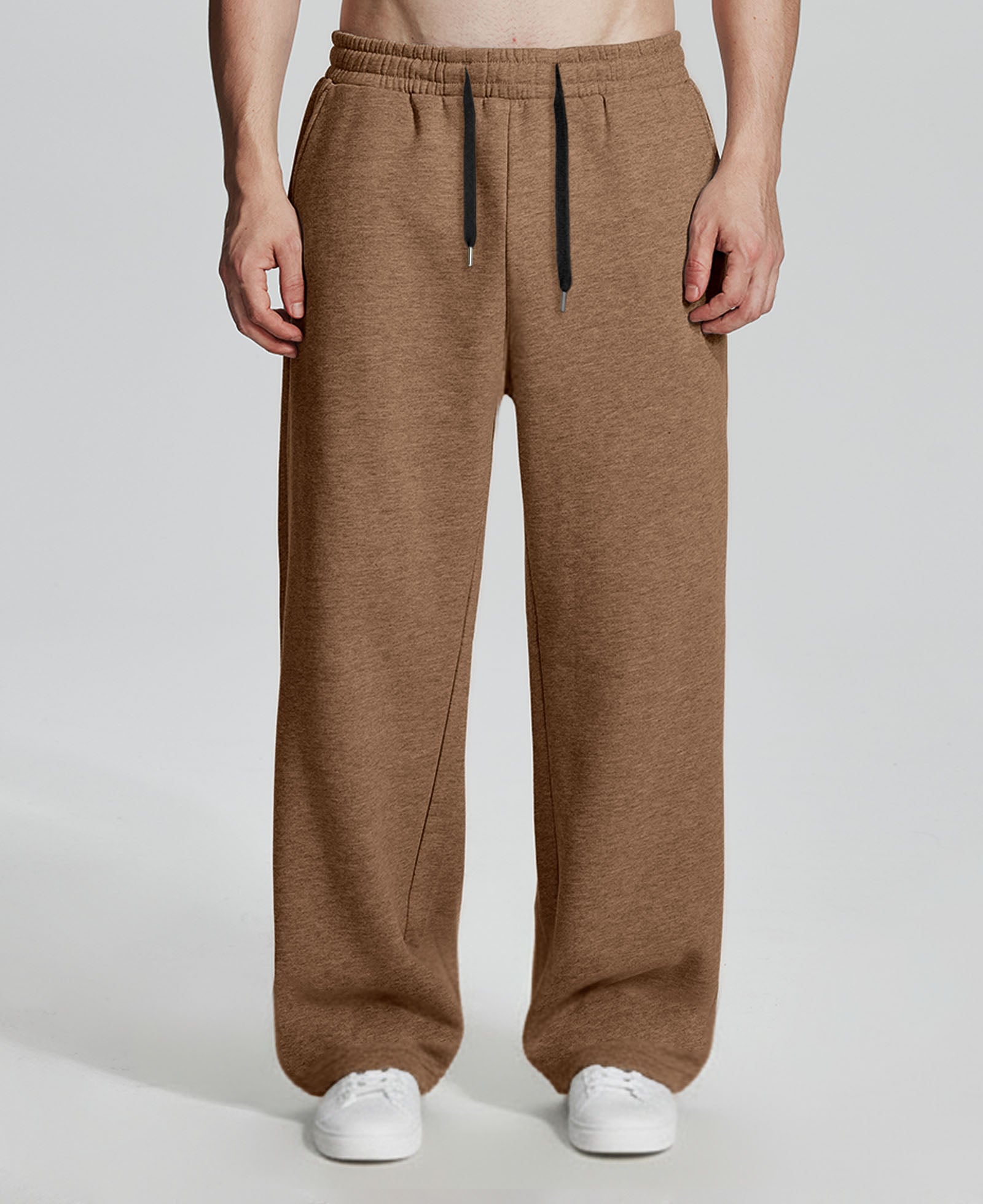 Model in coffee Men's Fleece Sweatpants ¨C Wide Leg Heavyweight Lounge Pants with white sneakers, showing drape and relaxed fit.
