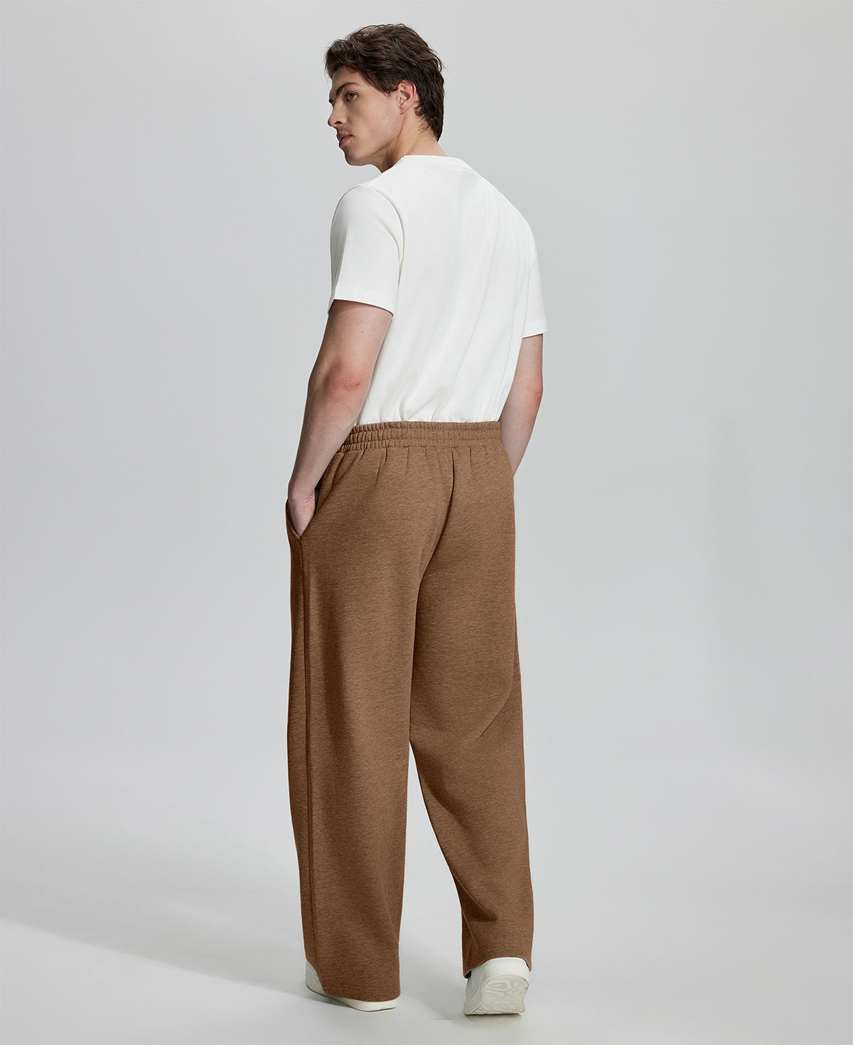 Back view of Men's Fleece Sweatpants ¨C relaxed drape and functional pockets enhance lounge-ready style.