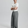 Side view of Men's Fleece Sweatpants ¨C wide-leg silhouette and cozy drape for ultimate comfort.