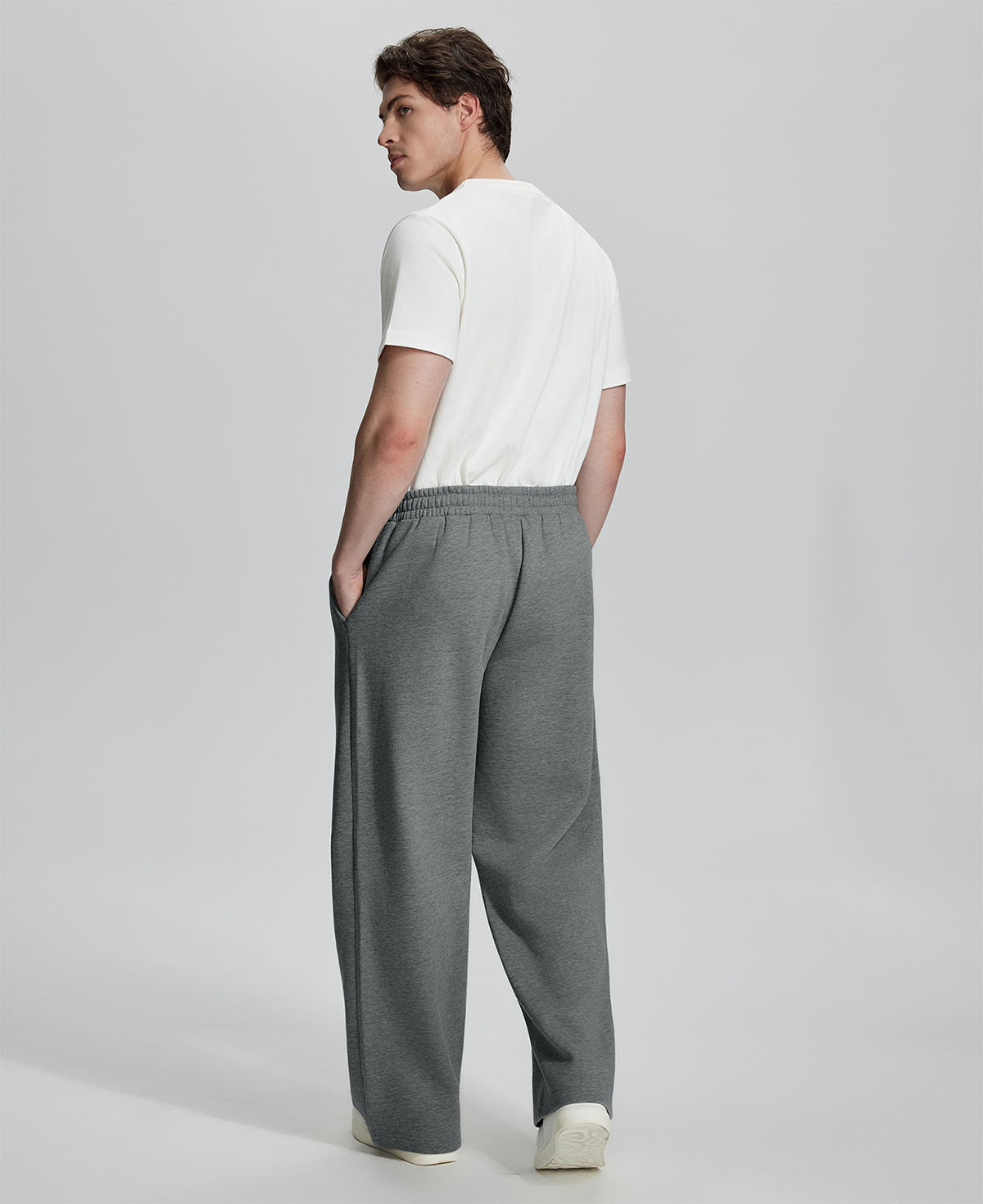 Back view of Men's Fleece Sweatpants ¨C relaxed drape and functional pockets enhance lounge-ready style.