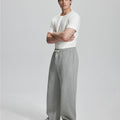 Side view of Men's Fleece Sweatpants ¨C wide-leg silhouette and cozy drape for ultimate comfort.