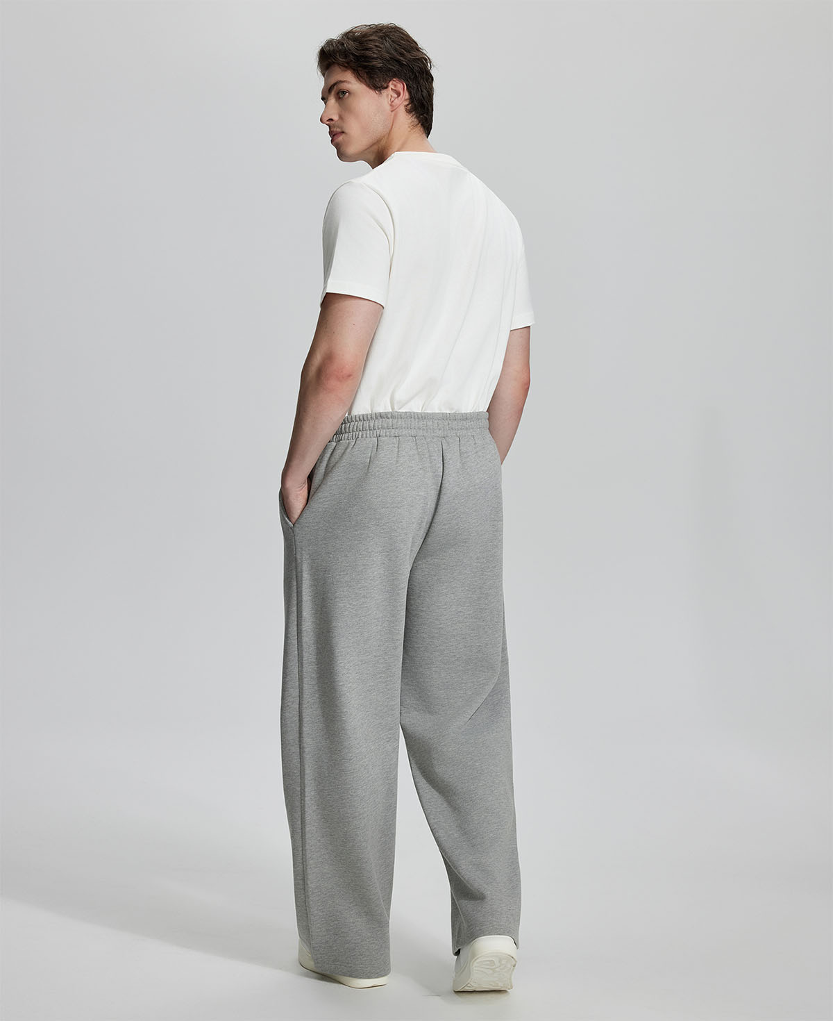 Back view of Men's Fleece Sweatpants ¨C relaxed drape and functional pockets enhance lounge-ready style.