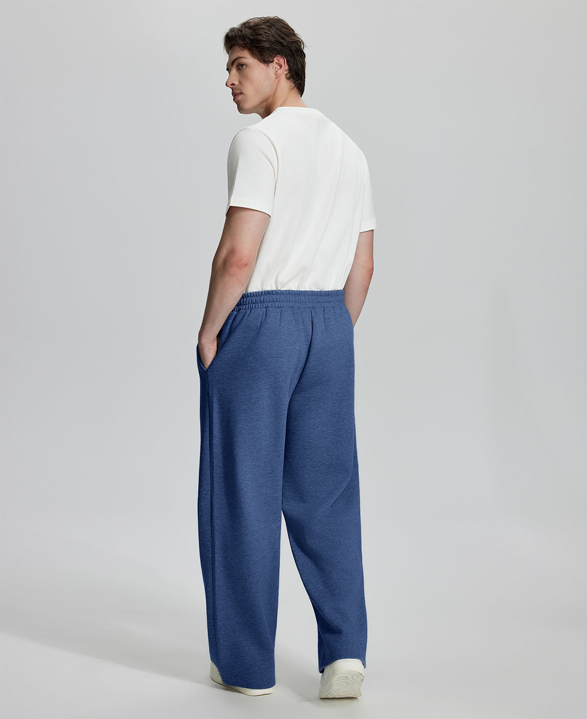 Back view of Men's Fleece Sweatpants ¨C relaxed drape and functional pockets enhance lounge-ready style.