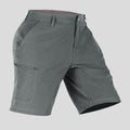 Side view of man in dark grey Men's Golf & Hiking Shorts, showing front pockets, button waistband, and side zip pocket details.