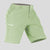 Side view of man in light green Men's Golf & Hiking Shorts, showing front pockets, button waistband, and side zip pocket details.