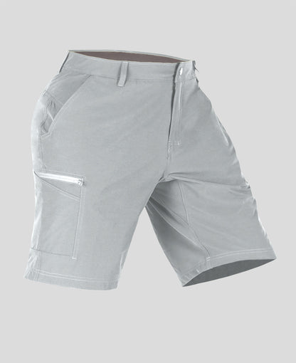 Side view of man in light gray Men's Golf & Hiking Shorts, showing front pockets, button waistband, and side zip pocket details.