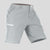 Side view of man in light gray Men's Golf & Hiking Shorts, showing front pockets, button waistband, and side zip pocket details.