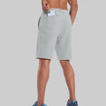 Back view of model with phone in back pocket of light gray shorts¡ªshowing storage space and rear silhouette design.