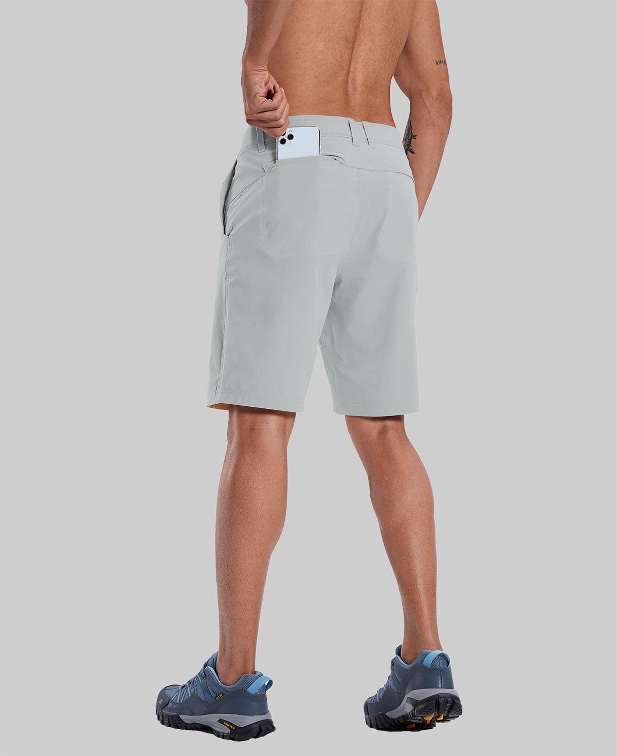 Back view of model with phone in back pocket of light gray shorts¡ªshowing storage space and rear silhouette design.