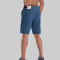 Back view of model with phone in back pocket of navy blue shorts¡ªshowing storage space and rear silhouette design.