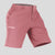 Side view of man in pink Men's Golf & Hiking Shorts, showing front pockets, button waistband, and side zip pocket details.