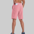 Back view of model with phone in back pocket of pink shorts¡ªshowing storage space and rear silhouette design.