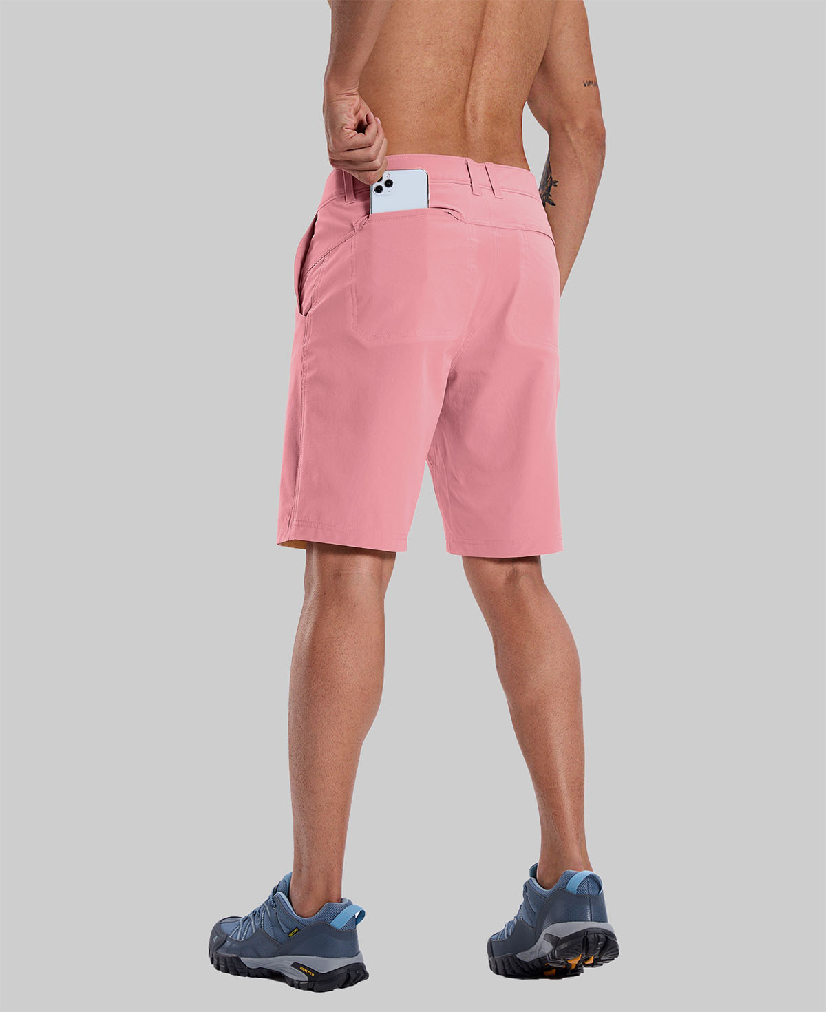 Back view of model with phone in back pocket of pink shorts¡ªshowing storage space and rear silhouette design.