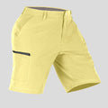 Side view of man in light yellow Men's Golf & Hiking Shorts, showing front pockets, button waistband, and side zip pocket details.