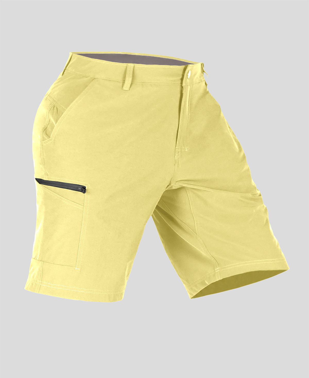 Side view of man in light yellow Men's Golf & Hiking Shorts, showing front pockets, button waistband, and side zip pocket details.