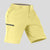 Side view of man in light yellow Men's Golf & Hiking Shorts, showing front pockets, button waistband, and side zip pocket details.