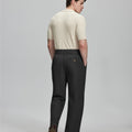 Back view of black Gurkha pants: elastic waistband and rear pockets for comfort without sacrificing silhouette.