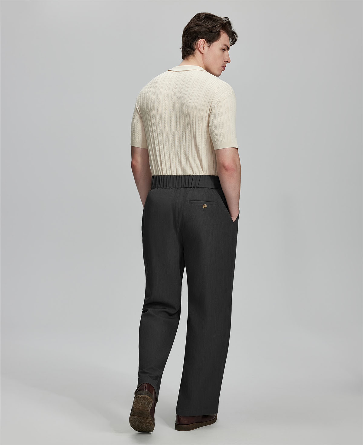 Back view of black Gurkha pants: elastic waistband and rear pockets for comfort without sacrificing silhouette.