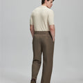 Back view of brown Gurkha pants: elastic waistband and rear pockets for comfort without sacrificing silhouette.