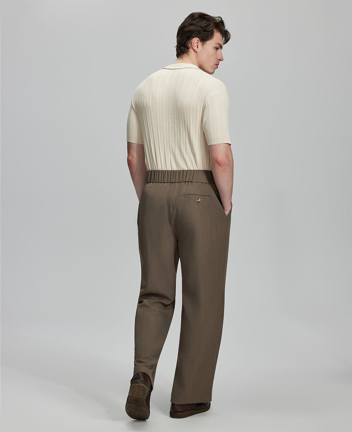 Back view of brown Gurkha pants: elastic waistband and rear pockets for comfort without sacrificing silhouette.