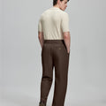 Back view of brown Gurkha pants: elastic waistband and rear pockets for comfort without sacrificing silhouette.