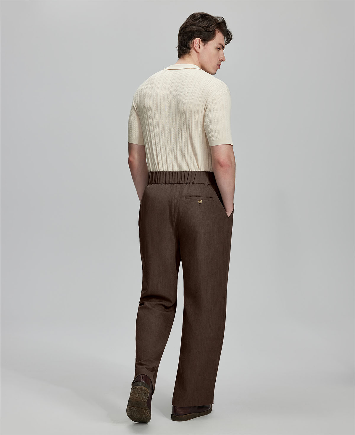 Back view of brown Gurkha pants: elastic waistband and rear pockets for comfort without sacrificing silhouette.