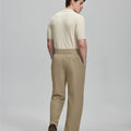 Back view of beige Gurkha pants: elastic waistband and rear pockets for comfort without sacrificing silhouette.