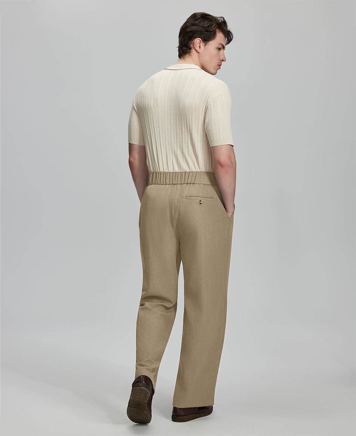 Back view of beige Gurkha pants: elastic waistband and rear pockets for comfort without sacrificing silhouette.