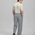 Back view of grey Gurkha pants: elastic waistband and rear pockets for comfort without sacrificing silhouette.