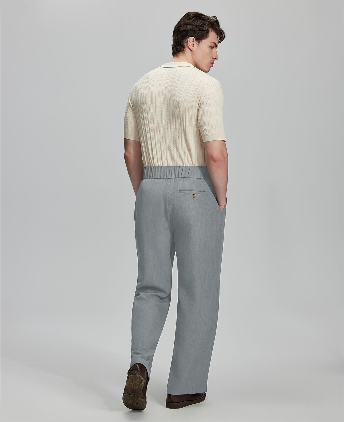 Back view of grey Gurkha pants: elastic waistband and rear pockets for comfort without sacrificing silhouette.