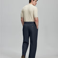 Back view of navy Gurkha pants: elastic waistband and rear pockets for comfort without sacrificing silhouette.