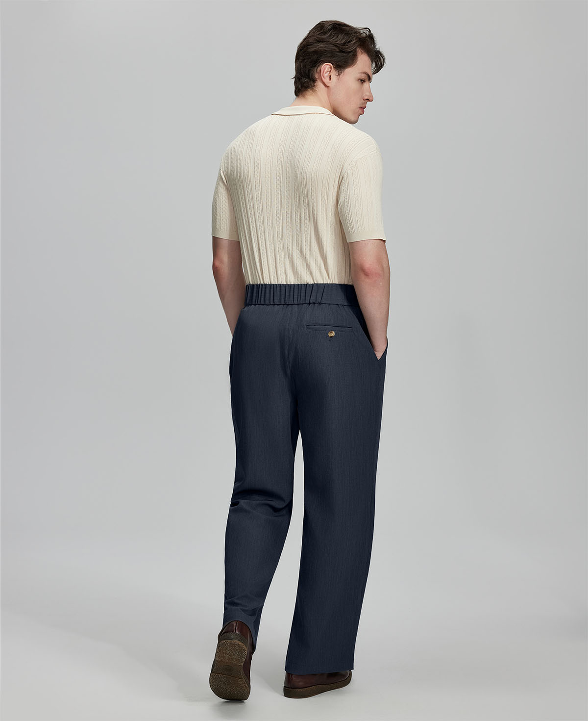 Back view of navy Gurkha pants: elastic waistband and rear pockets for comfort without sacrificing silhouette.