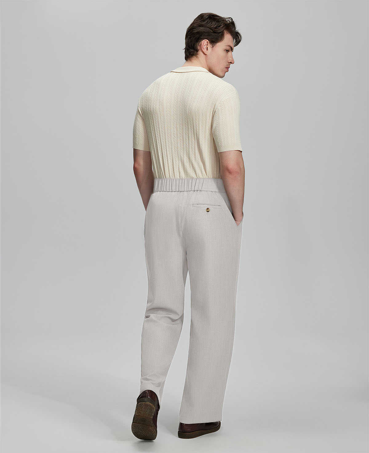 Back view of grey Gurkha pants: elastic waistband and rear pockets for comfort without sacrificing silhouette.
