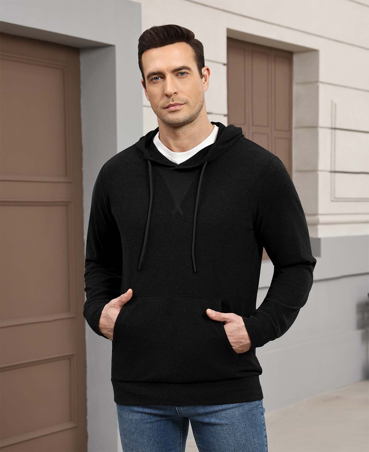 Wearing black Men's Hoodie Pullover Sweater outdoors, hood adds casual comfort for daily errands or walks.