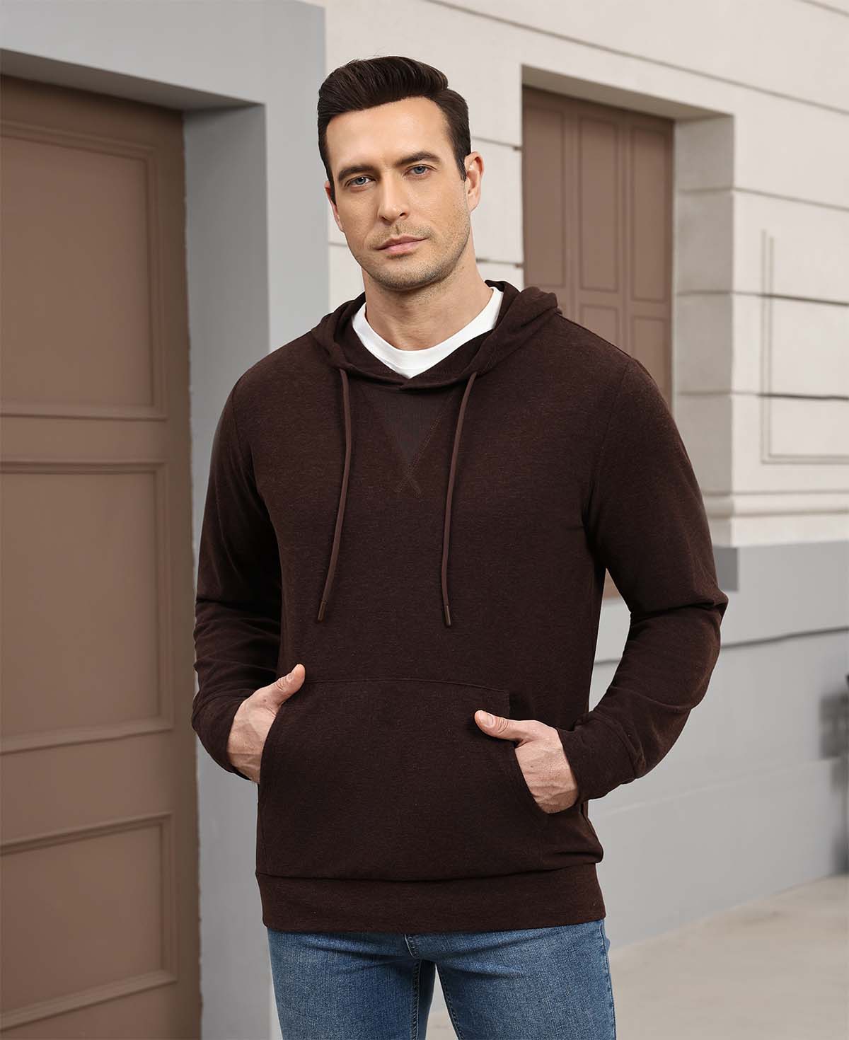 Wearing dark brown Men's Hoodie Pullover Sweater outdoors, hood adds casual comfort for daily errands or walks.