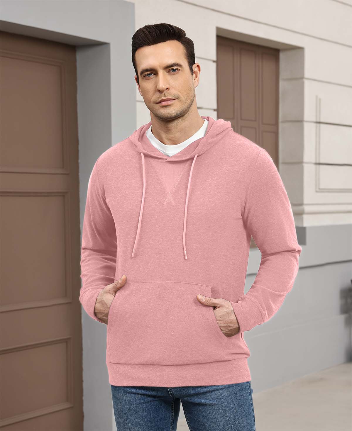 Wearing pink Men's Hoodie Pullover Sweater outdoors, hood adds casual comfort for daily errands or walks.