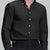 Man in black Men's Oxford Button Down Dress Shirt ¨C Wrinkle Resistant, with matching trousers and hand in pocket.