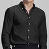 Man in black Men's Oxford Button Down Dress Shirt ¨C Wrinkle Resistant, with matching trousers and hand in pocket.