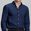 Man in navy blue Men's Oxford Button Down Dress Shirt ¨C Wrinkle Resistant, with matching trousers and hand in pocket.
