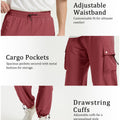 Adjustable waistband, spacious cargo pockets with metal buttons, adjustable cuffs for comfort and style in baggy sweatpants.