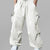 Man in white baggy sweatpants, high waist, five pockets, back logo. White sneakers, standing front.