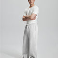 Side view of Men's Fleece Sweatpants ¨C wide-leg silhouette and cozy drape for ultimate comfort.