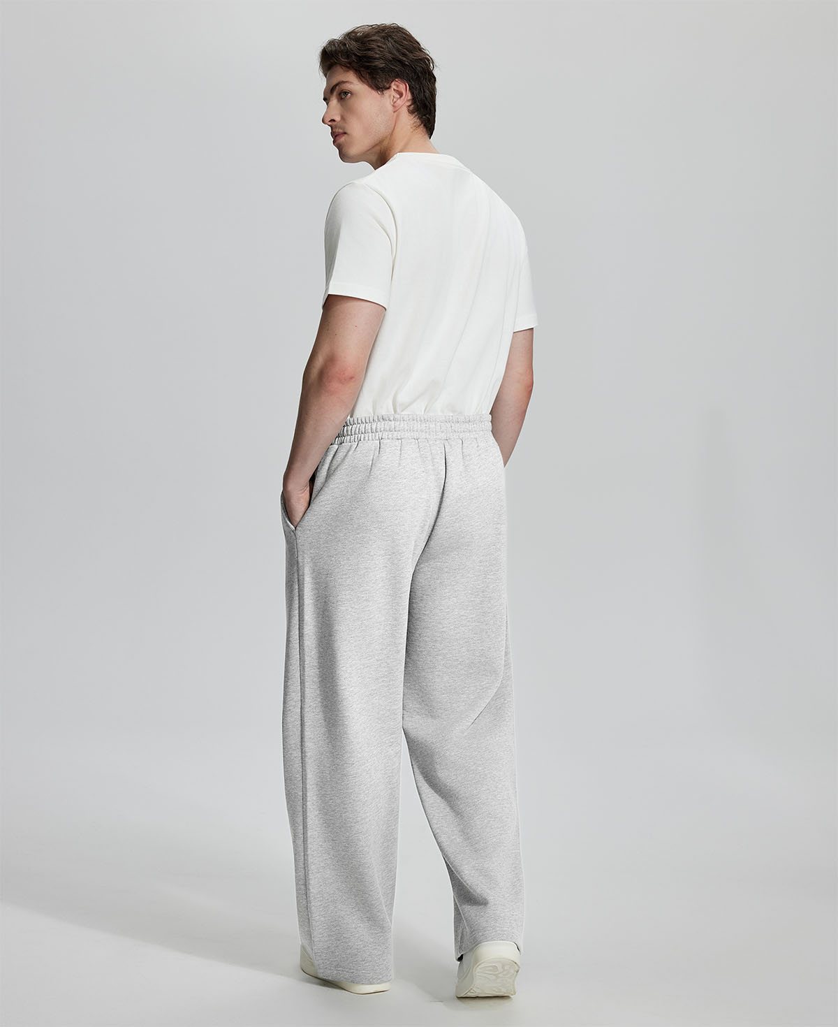 Back view of Men's Fleece Sweatpants ¨C relaxed drape and functional pockets enhance lounge-ready style.