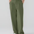 Model showcasing army green Men's Pleated Baggy Dress Pants highlighting soft color and elegant drape.