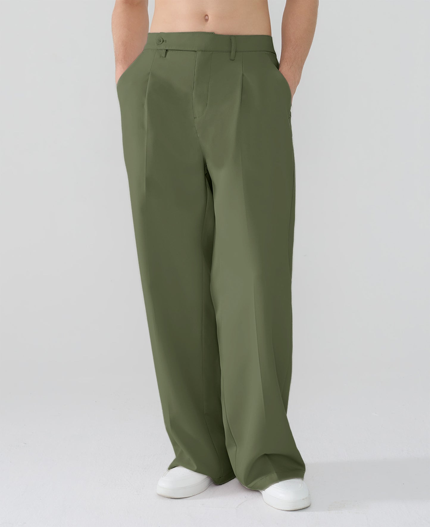 Model showcasing army green Men's Pleated Baggy Dress Pants highlighting soft color and elegant drape.