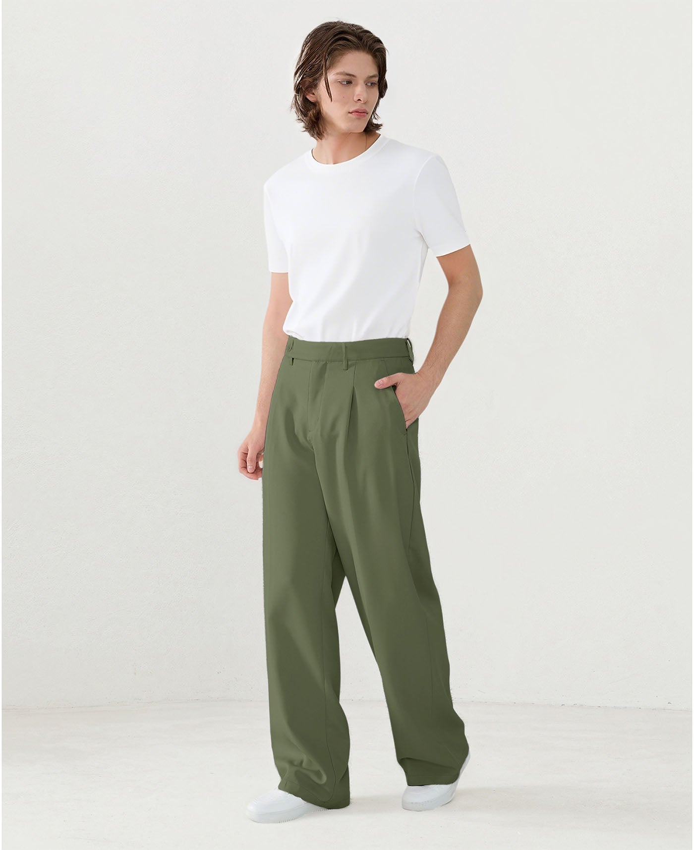 Model in white tee paired with army green Men's Pleated Baggy Dress Pants showing fresh casual style.